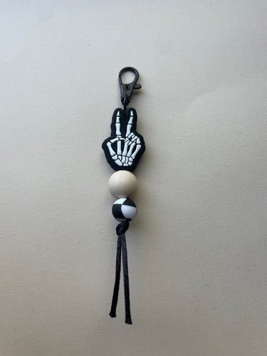 exclusive silicone focal bead, silicone keychain. skeleton peace hand